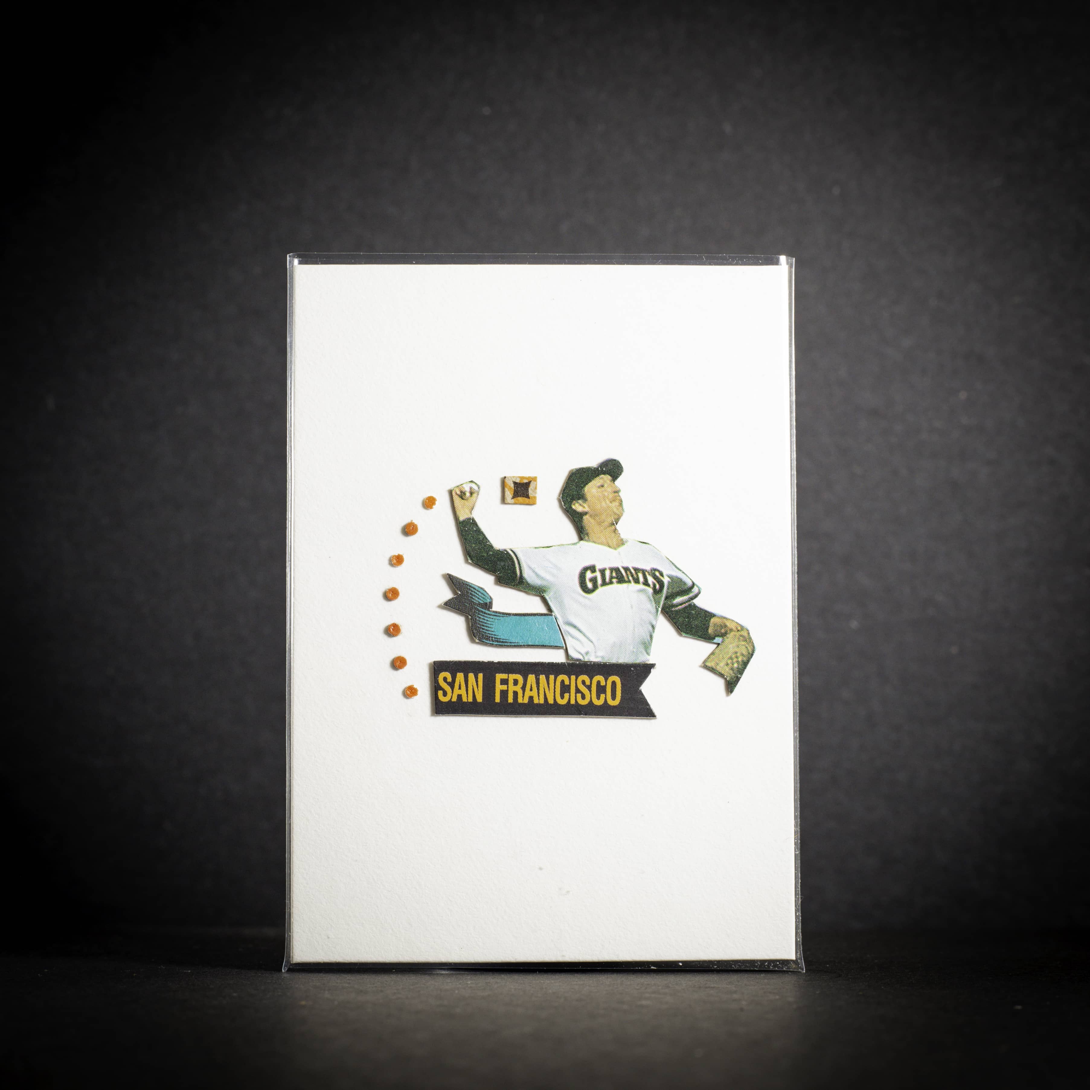 Vintage-style baseball card with a player in a San Francisco Giants uniform on a dark background