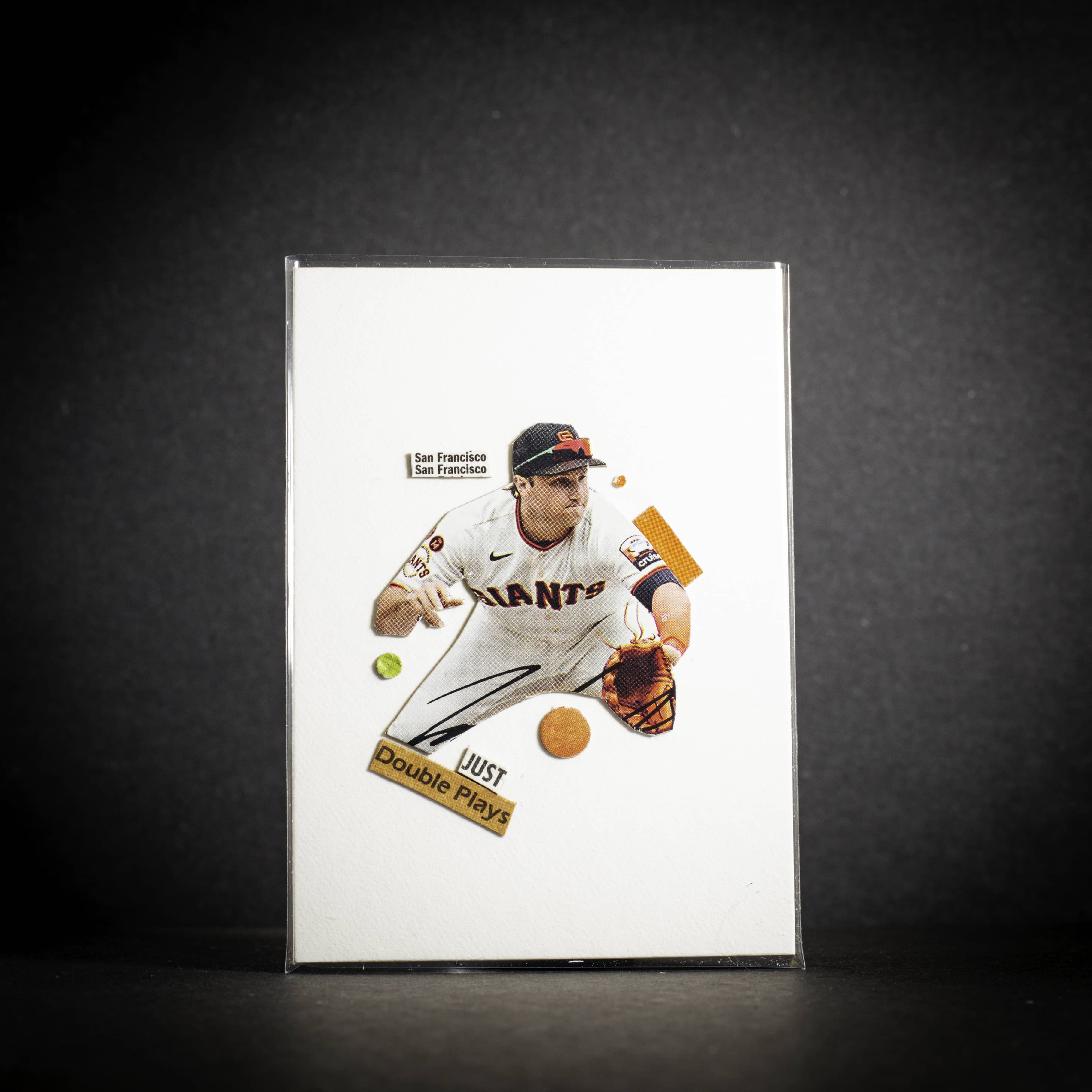 Baseball player in uniform with 'Just Double Play' text on a dark background