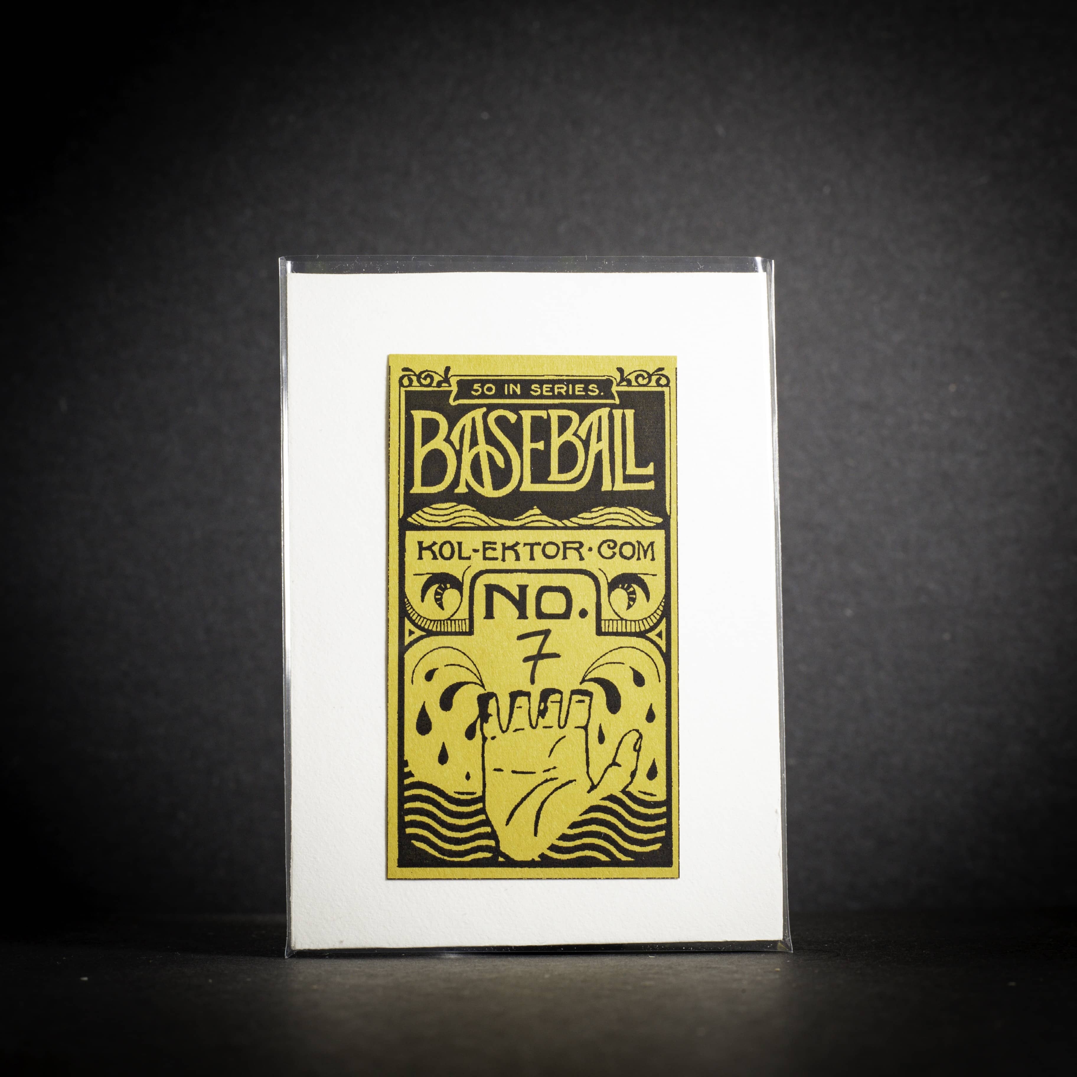 Framed collectible card with yellow text and graphics on a black background
