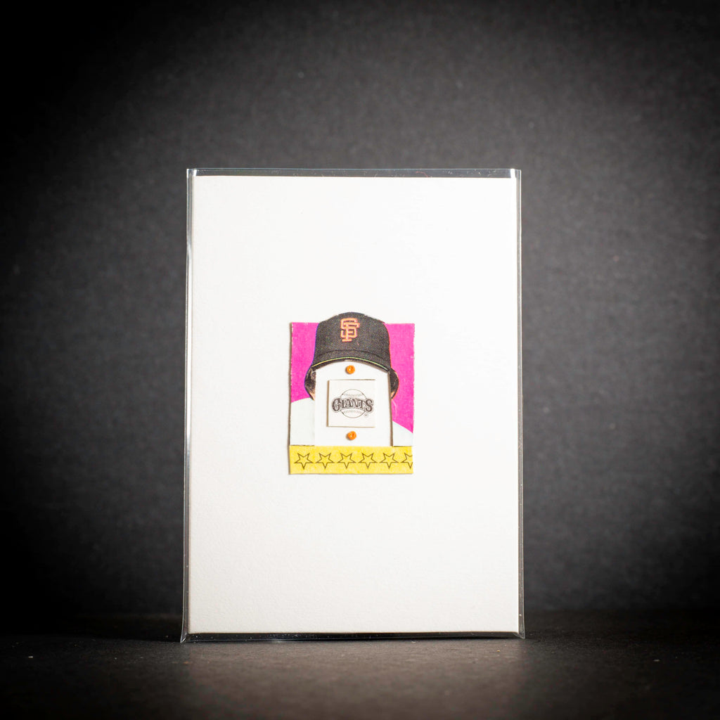 Card with a baseball cap design on a dark background