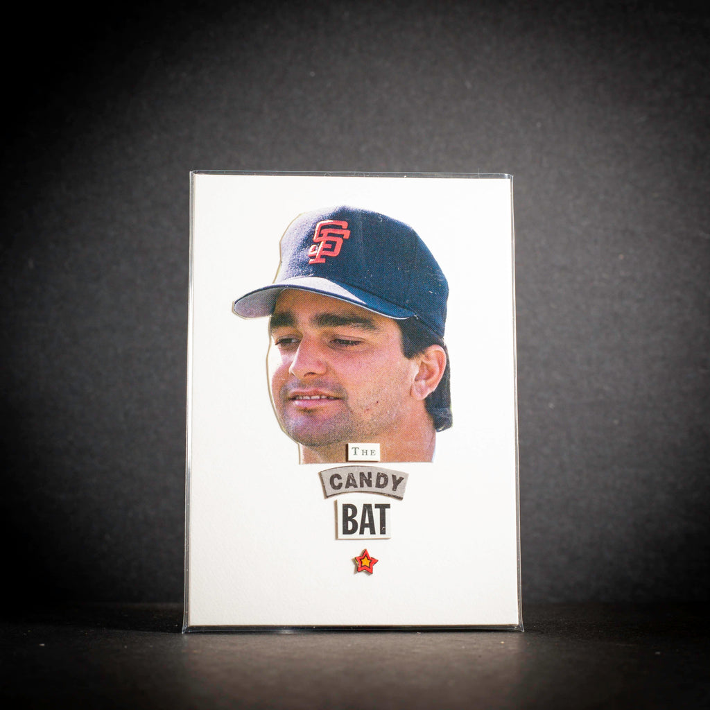 Trading card of a baseball player wearing a cap with 'Candy Bat' branding on a dark background