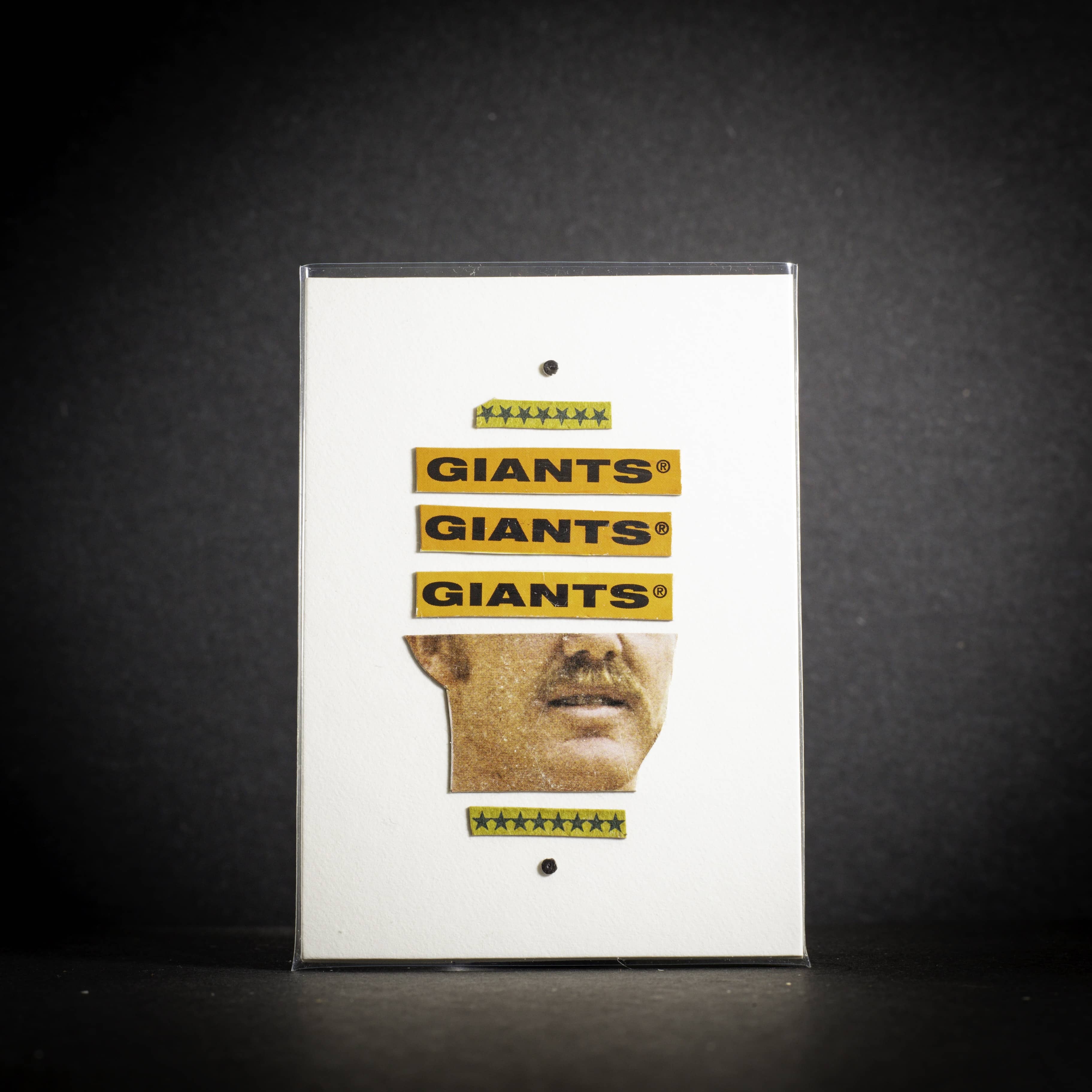 Product packaging with 'GIANTS' branding on a dark background