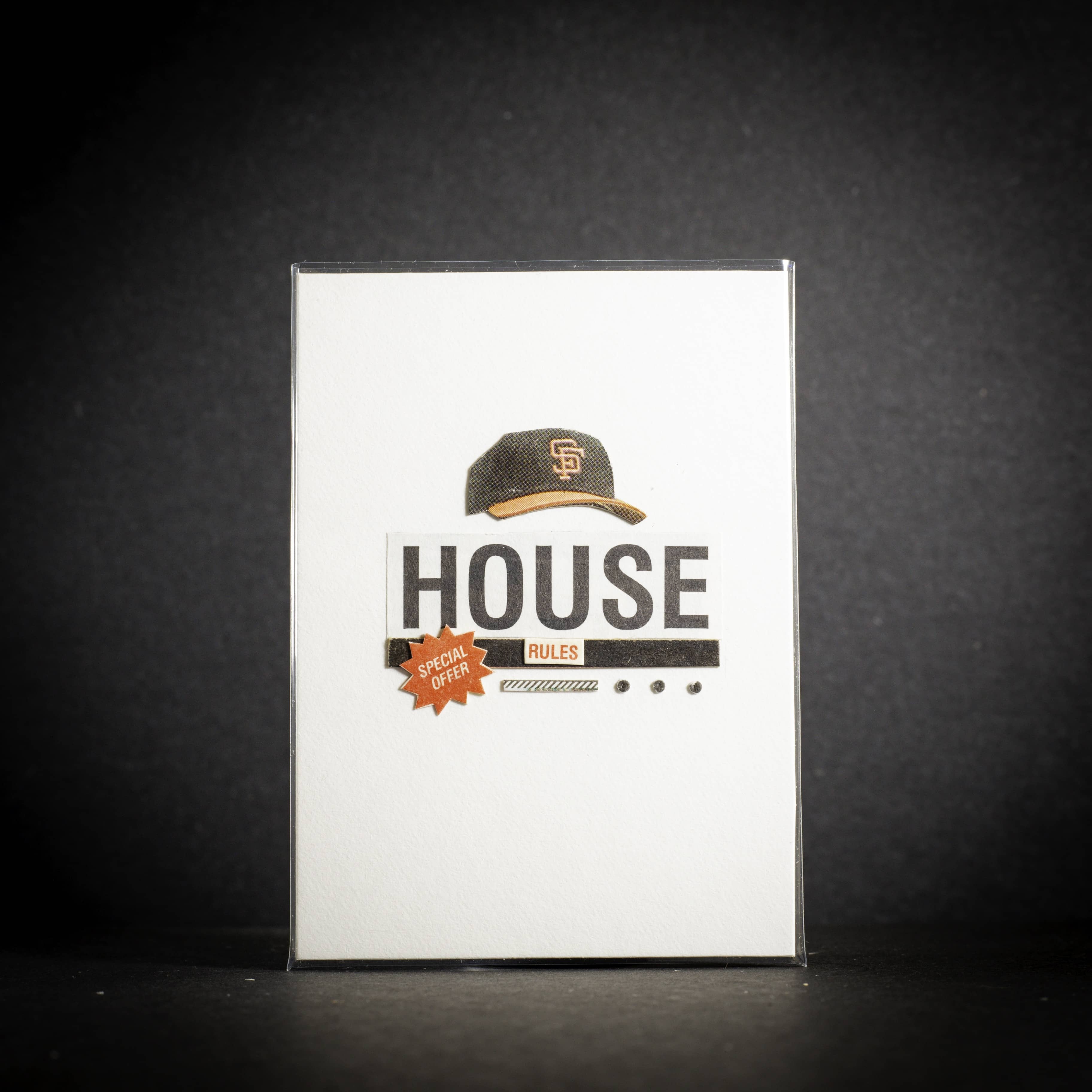 Product packaging with a cap design and text on a dark background