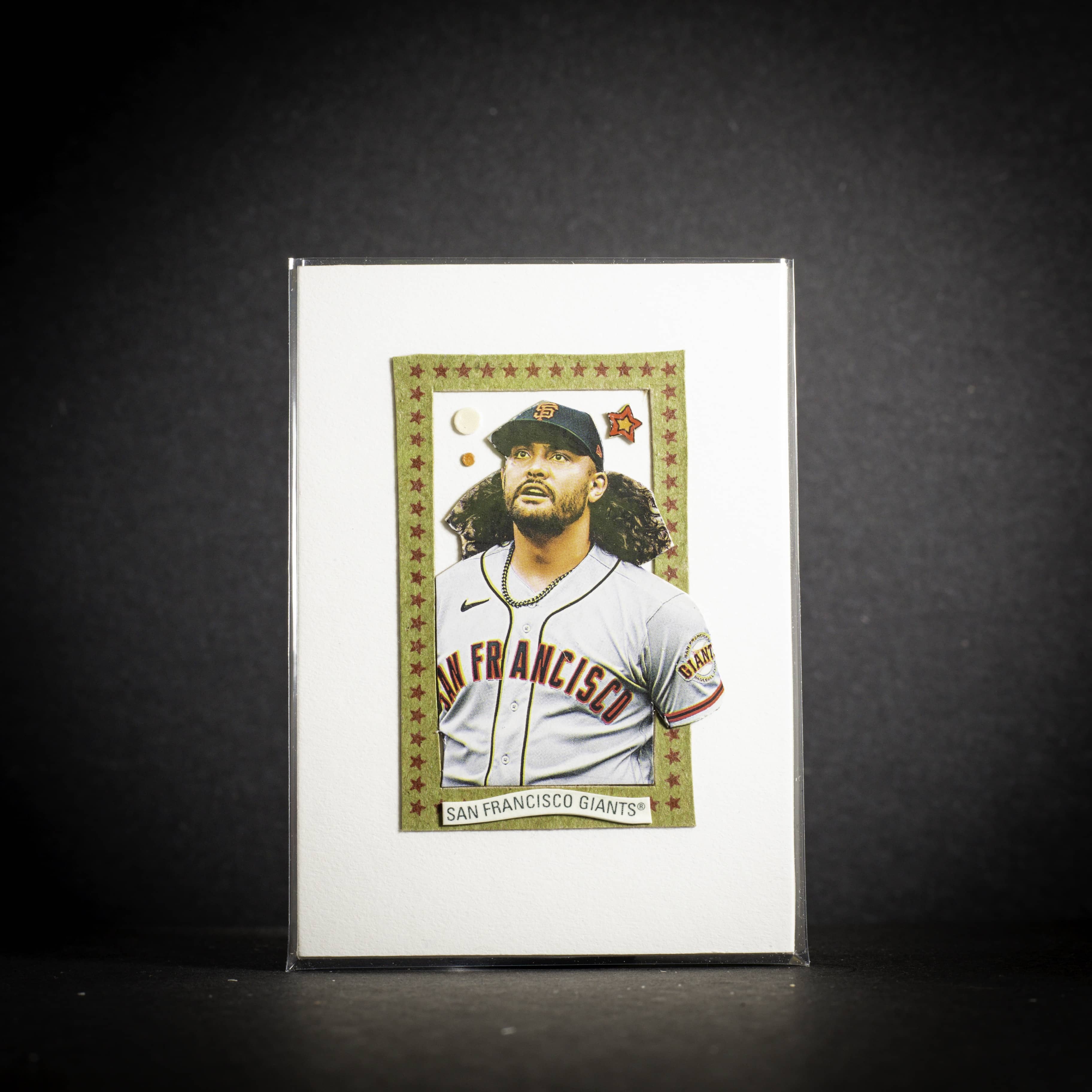 Baseball trading card of a player in a San Francisco Giants uniform on a dark background