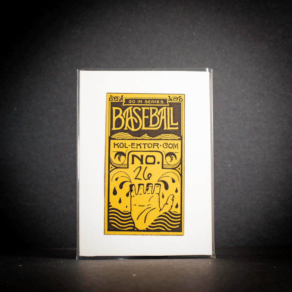 Baseball card packaging with gold and black design on a white background