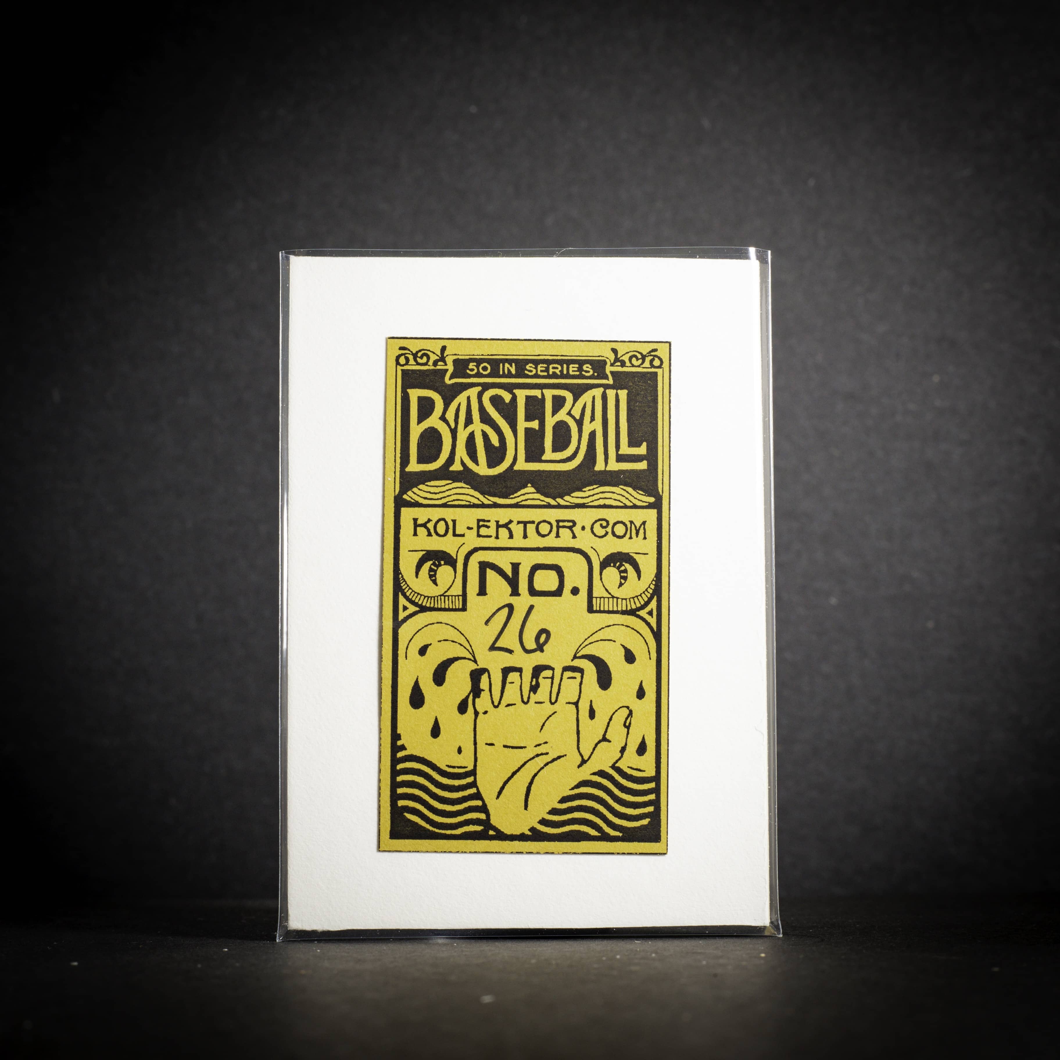 Baseball card packaging with gold and black design on a white background