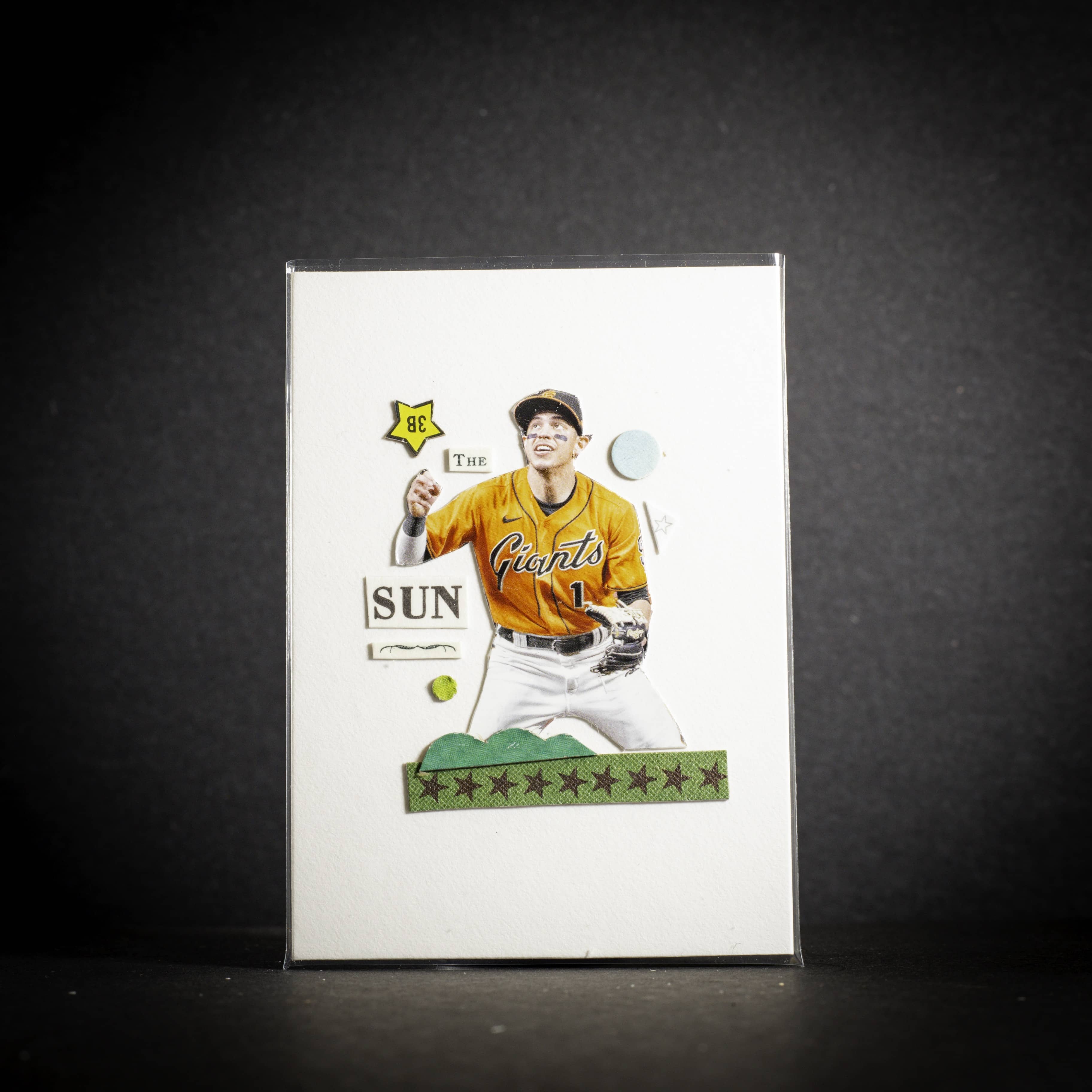 Baseball trading card of a player in a yellow jersey with 'Sun' and 'Giants' text on a dark background