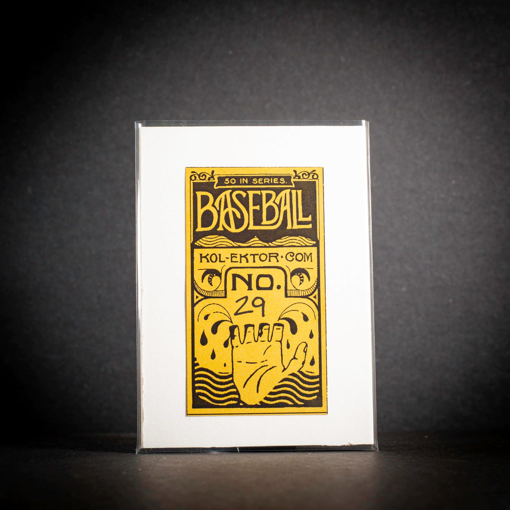 Baseball card packaging with yellow text and design on a black background
