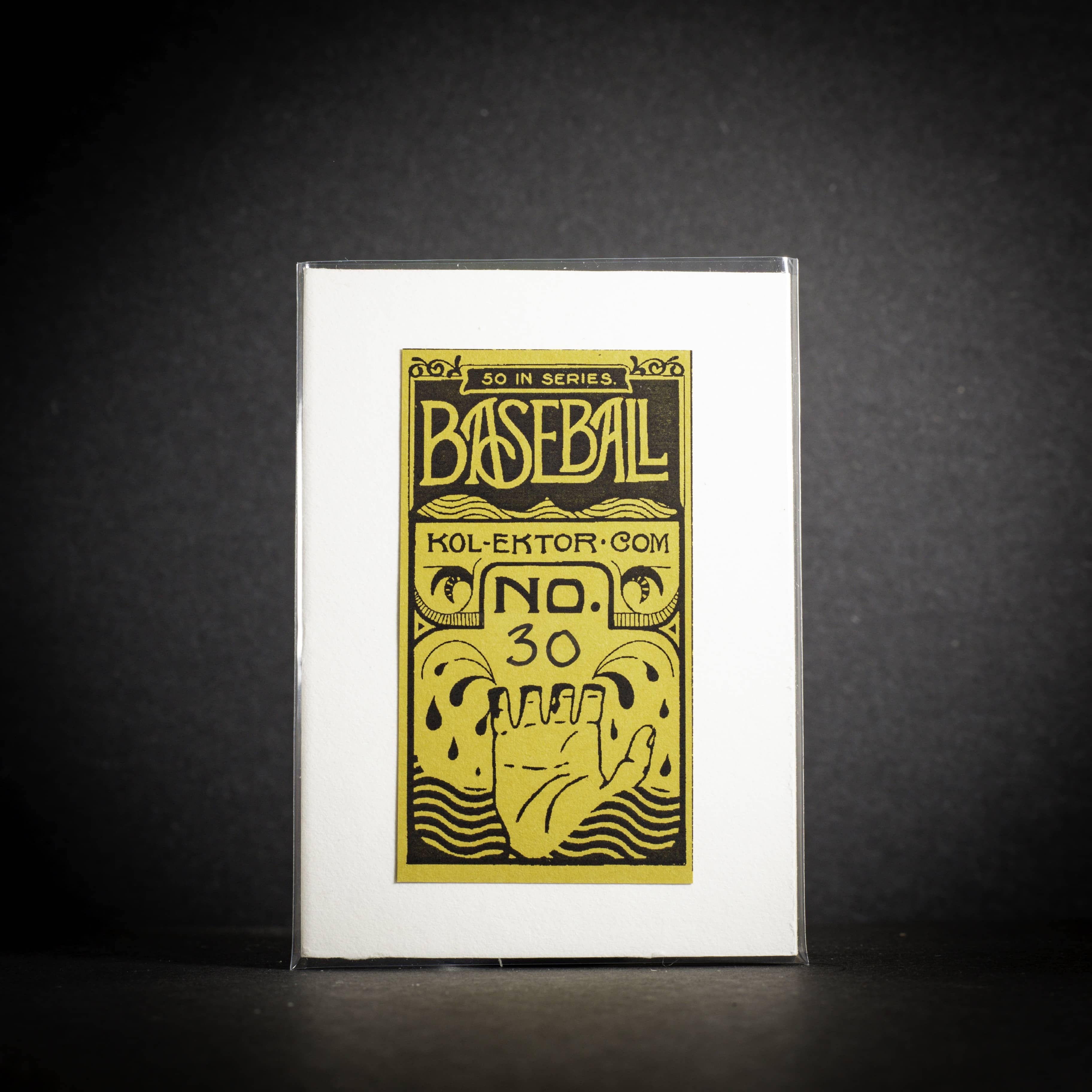 Baseball card packaging with yellow text and design on a black background