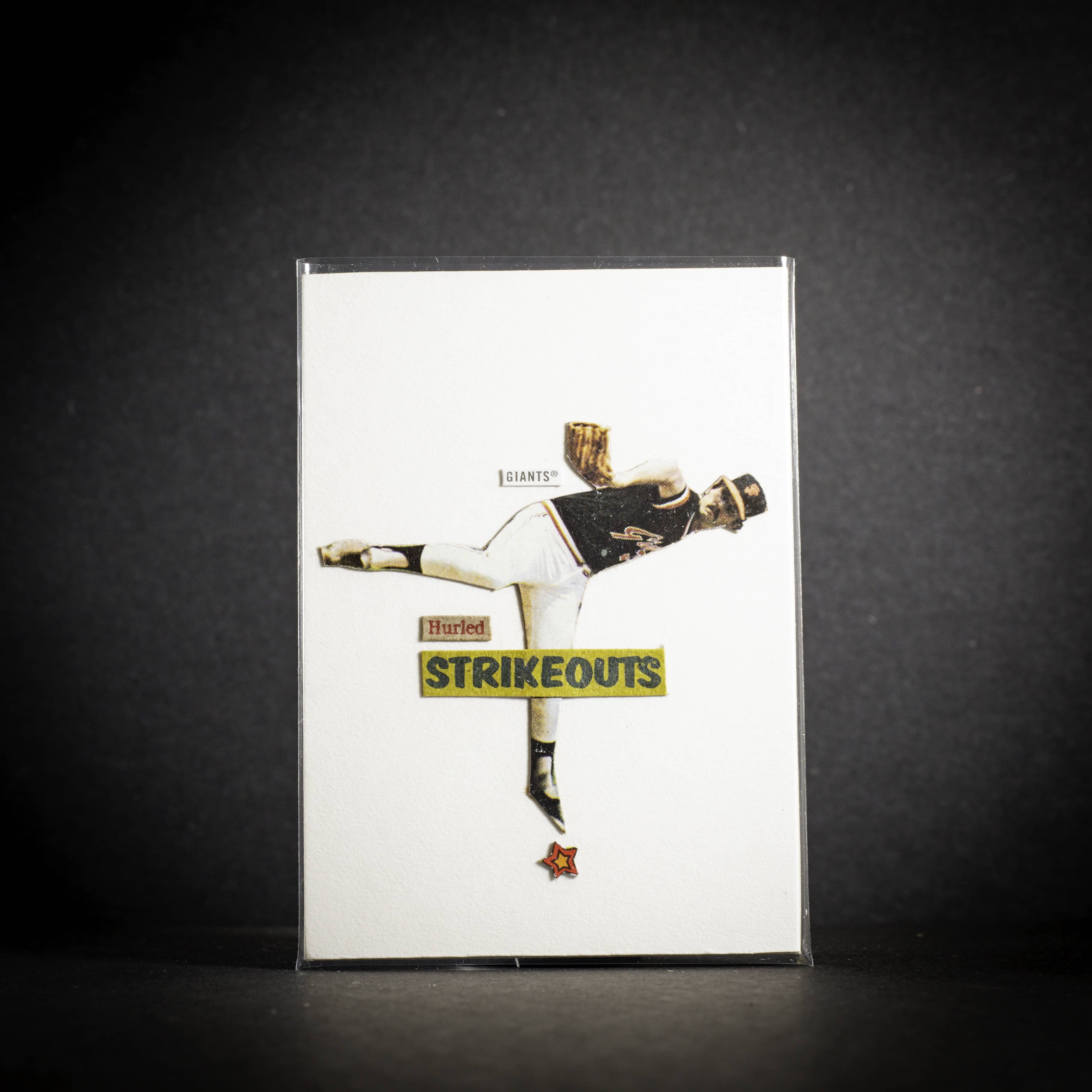Card with a graphic of a person in a dynamic pose, wearing a 'Strikeouts' shirt, on a white background.