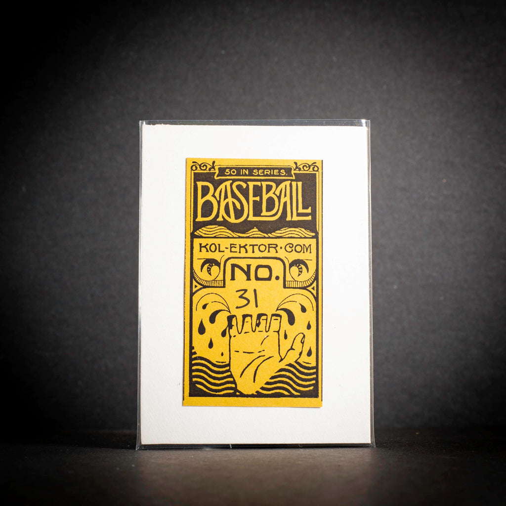 Baseball card with yellow text and graphics on a white card, against a dark background