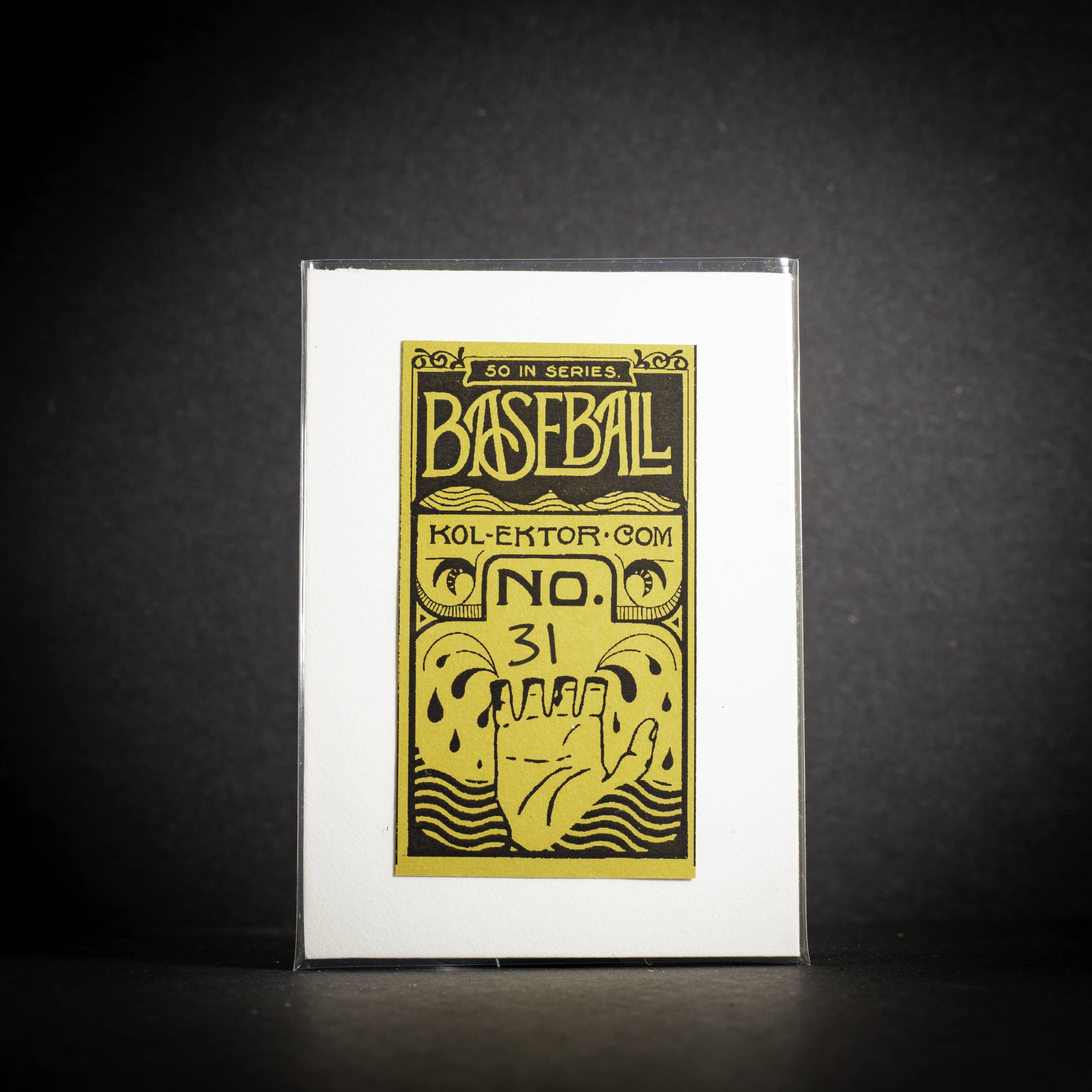 Baseball card with yellow text and graphics on a white card, against a dark background