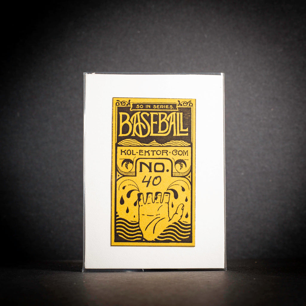 Baseball trading card in a protective sleeve on a dark background
