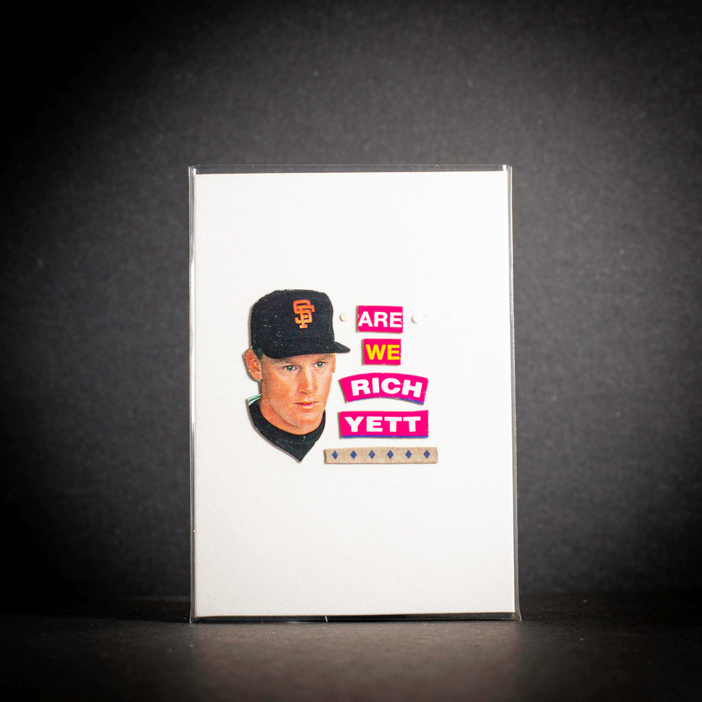 Baseball card of a player with text 'Are We Rich Yett?' on a dark background