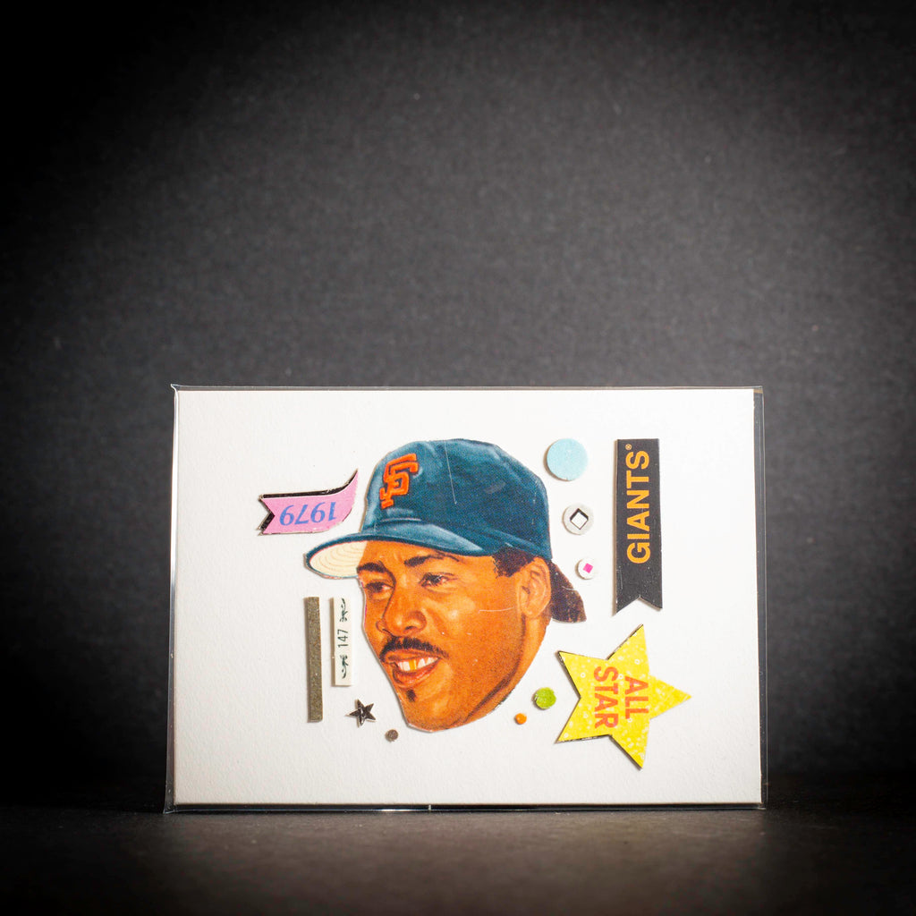 Baseball trading card of a player wearing a Giants cap on a dark background