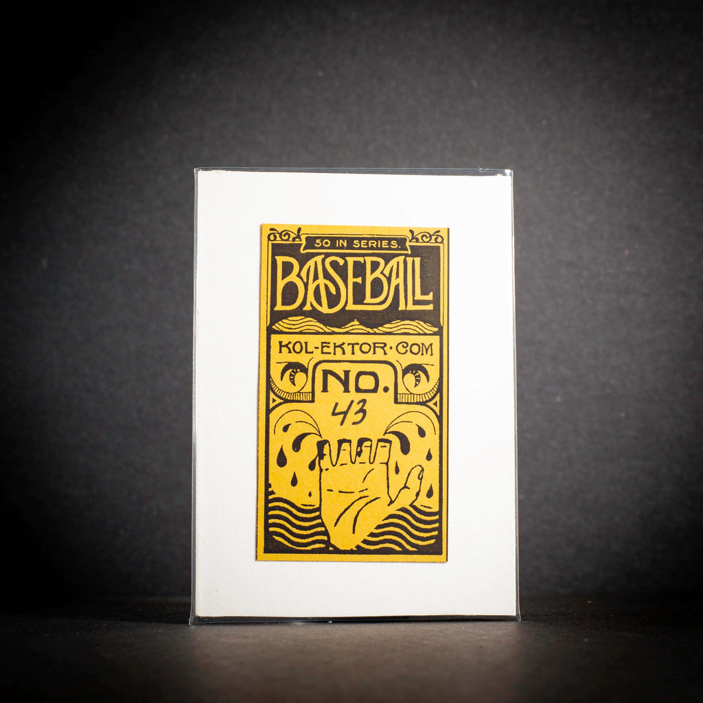 Baseball card with gold text and design on a white background
