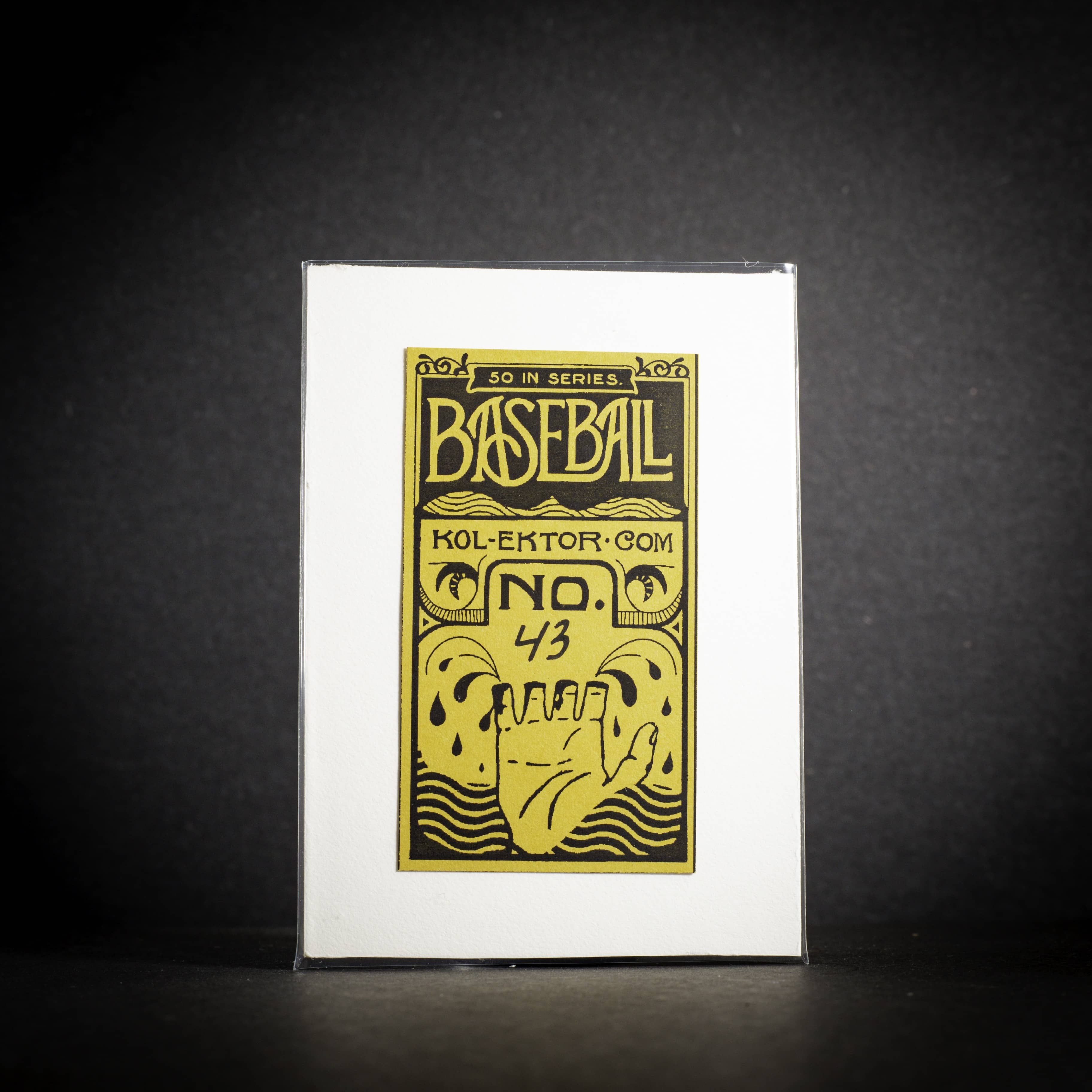 Baseball card with gold text and design on a white background