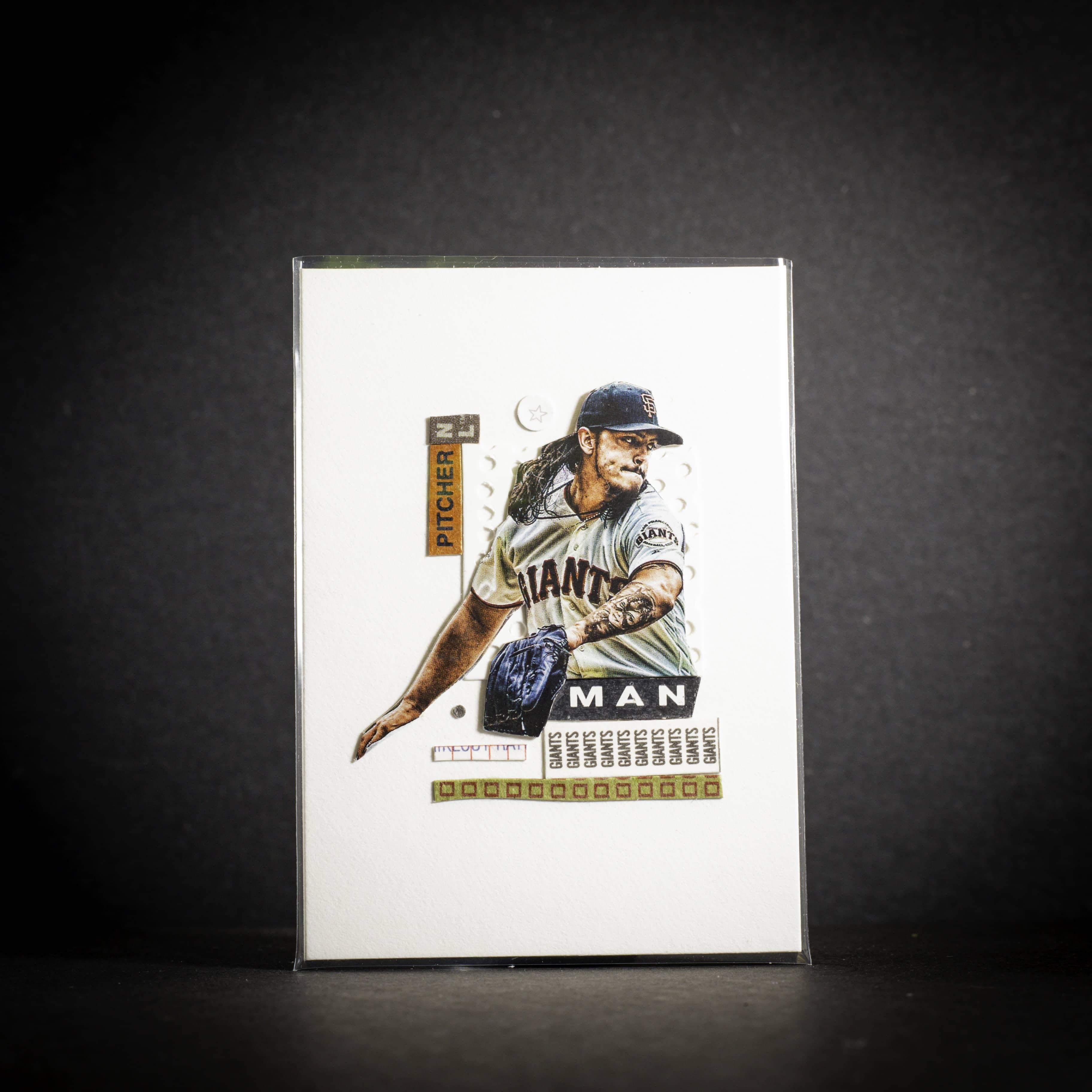 Baseball trading card of a pitcher on a dark background