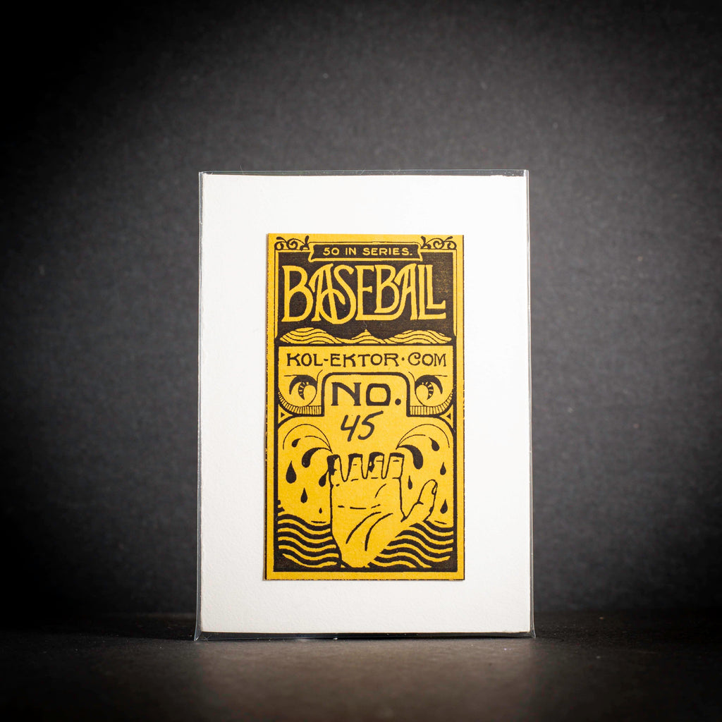 Baseball card with yellow and black design on a white card against a dark background