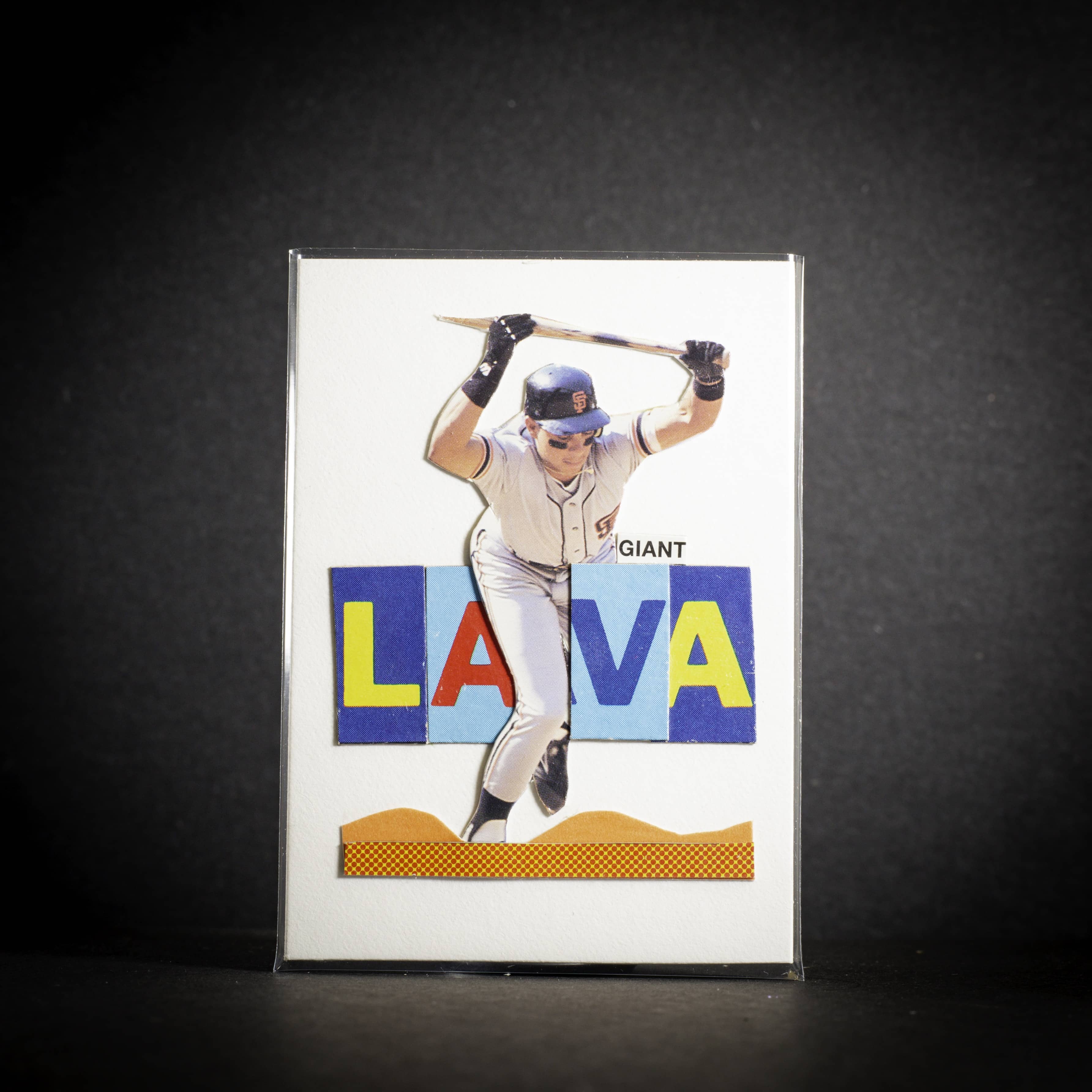 Baseball card with a player in a batting pose and colorful 'LAVA' text on a dark background