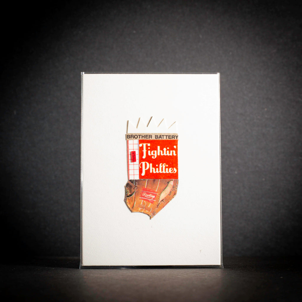 Notebook with 'Brother Battery Fighting Phillies' logo on a dark background